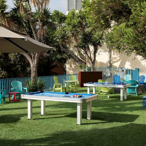 A sunny park scene with benches, a person walking, and a dog; trees and open space under blue skies. Top it at 140 characters, always ending the sentence.